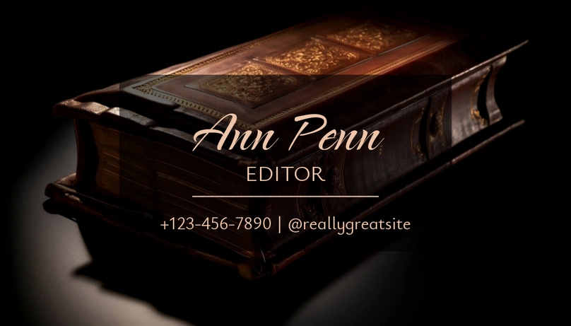 A business card design featuring a book with the name 'Ann Penn' and contact information