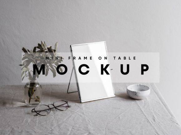 Mini Gold Frame on Table Mockup Graphic Product Mockups By MockupForest